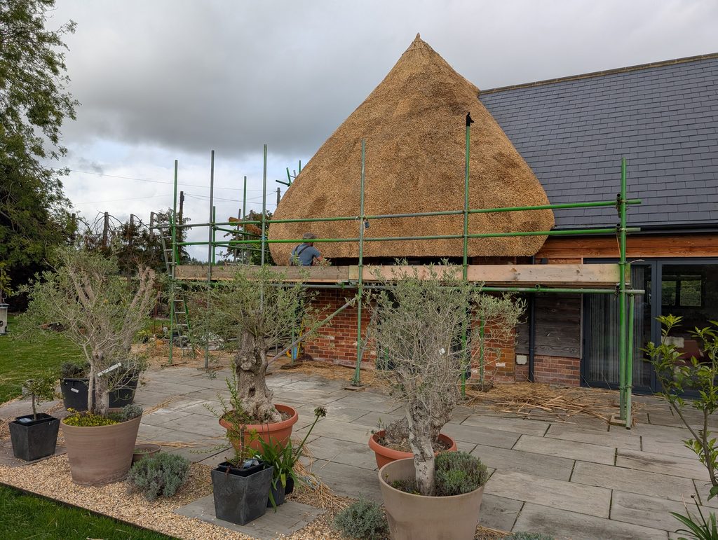 Cat-slide water reed thatched roof in Wiltshire